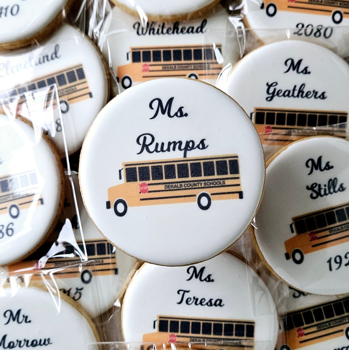 round logo cookies with buses and driver's names